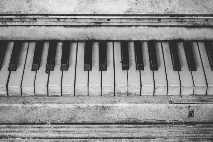 Black and white close-up of vintage piano keys, showcasing musical nostalgia.